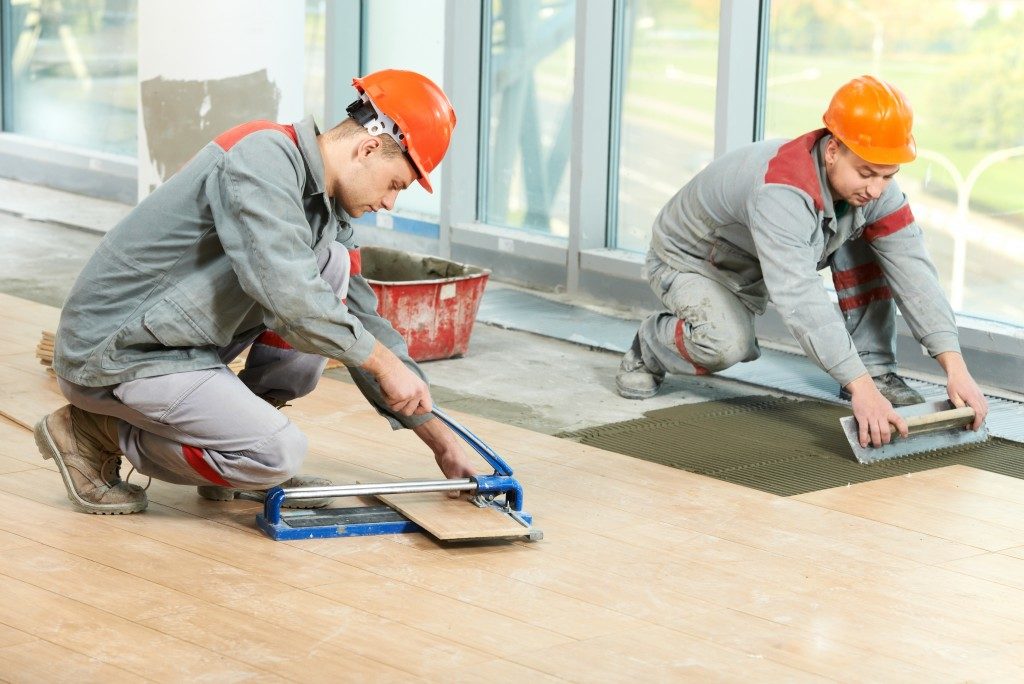Construction Workers Tiling