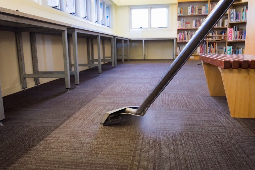 Steam cleaning the carpet in the library