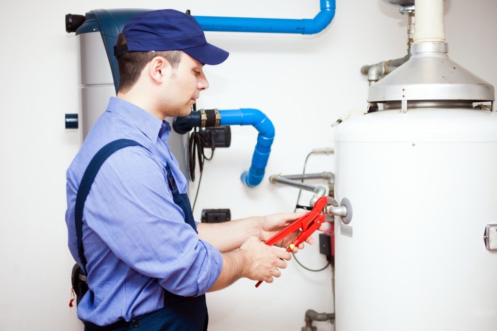 plumbing inspecting water heater