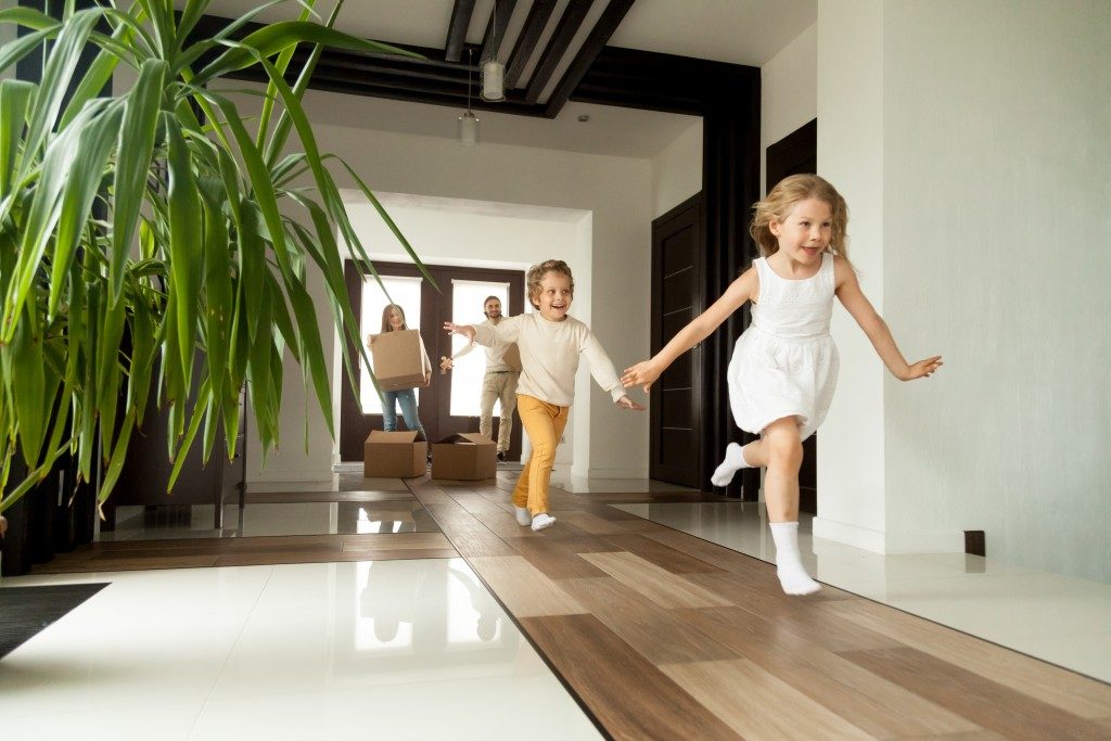 Kids running around their new house