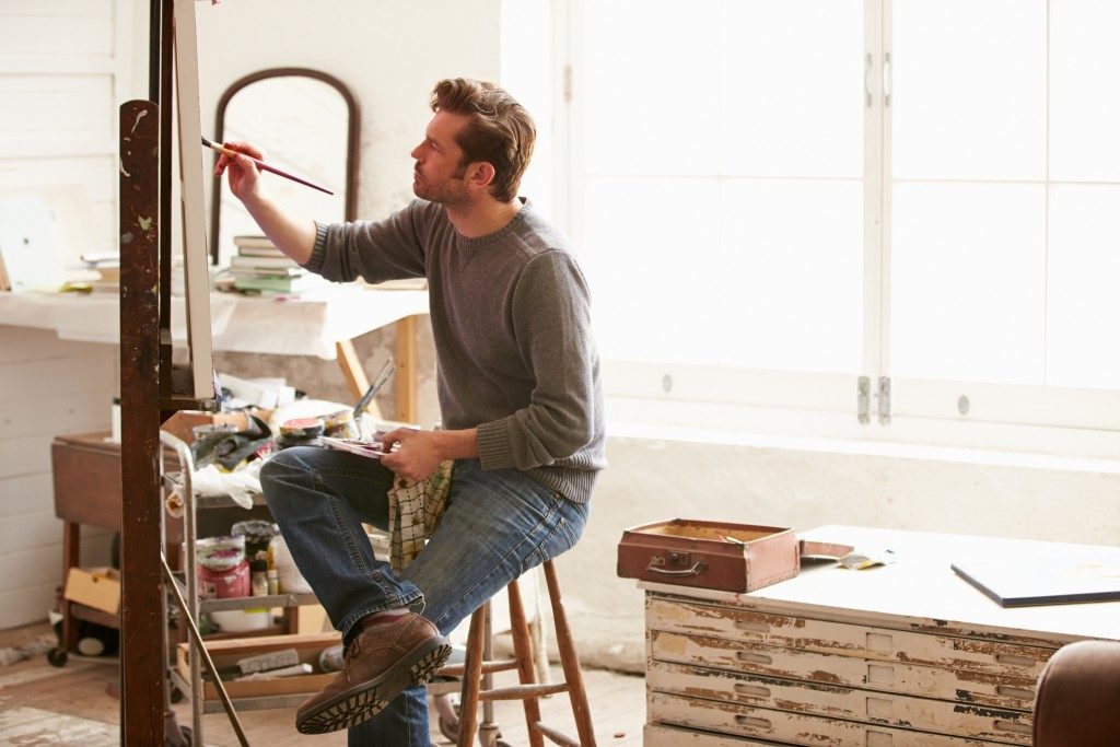Man painting in his studio